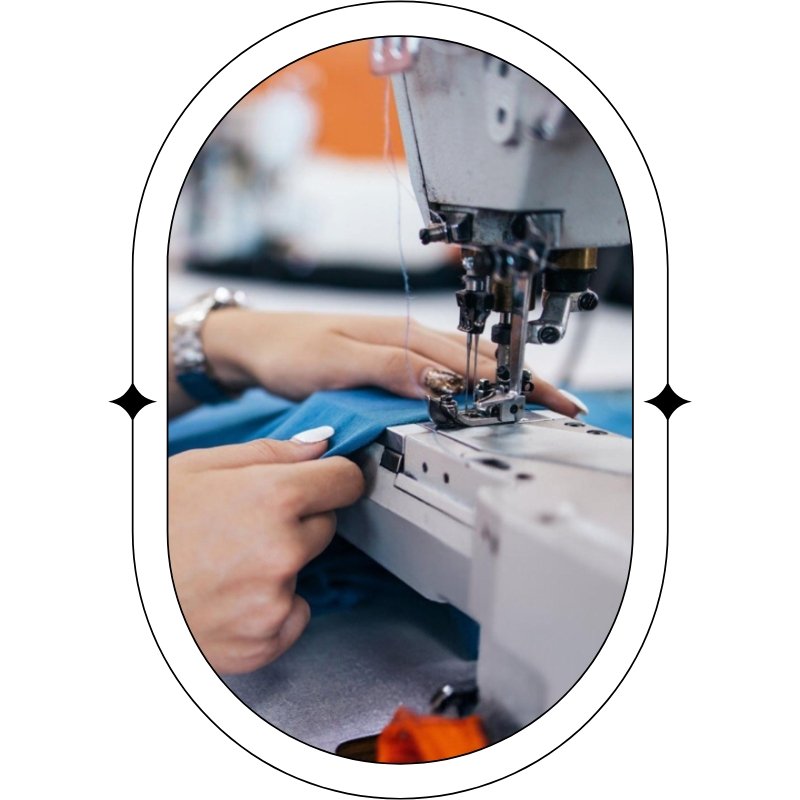 person is engaged in sewing a blue shirt