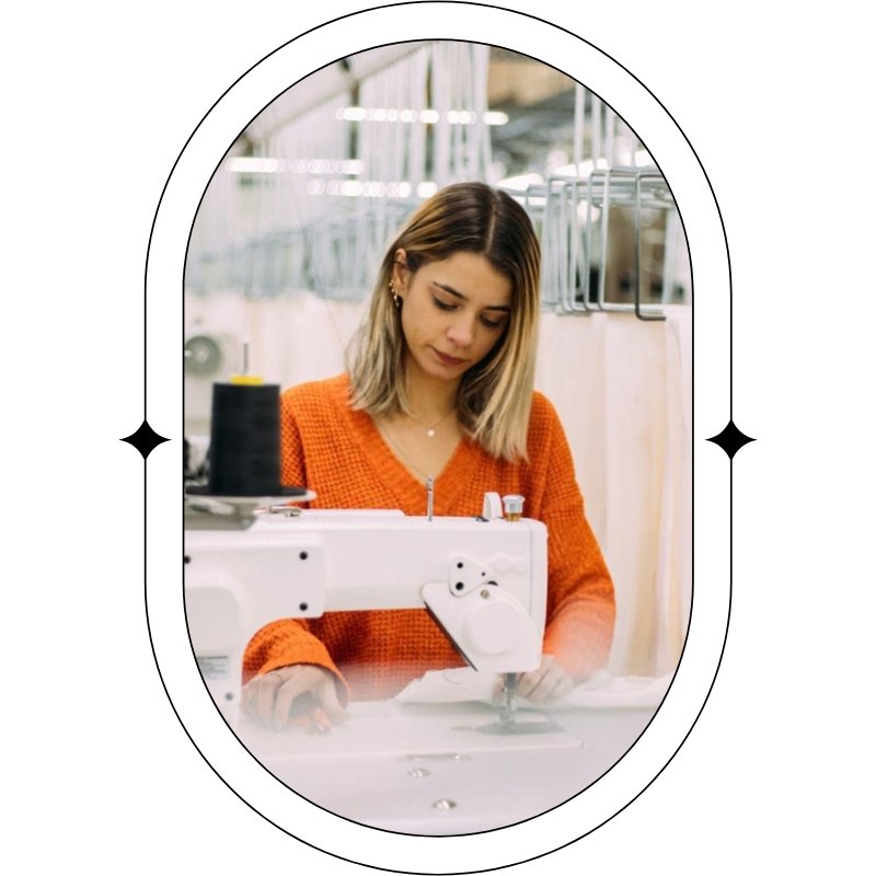 woman operates a sewing machine in a factory