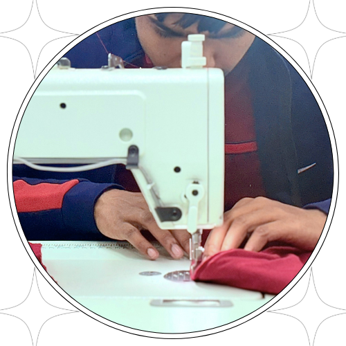 An individual skillfully operates a sewing machine